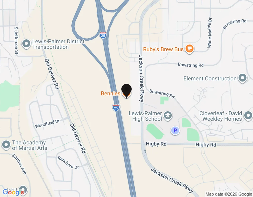 A map view near Interstate 25 with a pin marking a location labeled Bennies, surrounded by nearby streets, businesses, and Lewis Palmer High School
