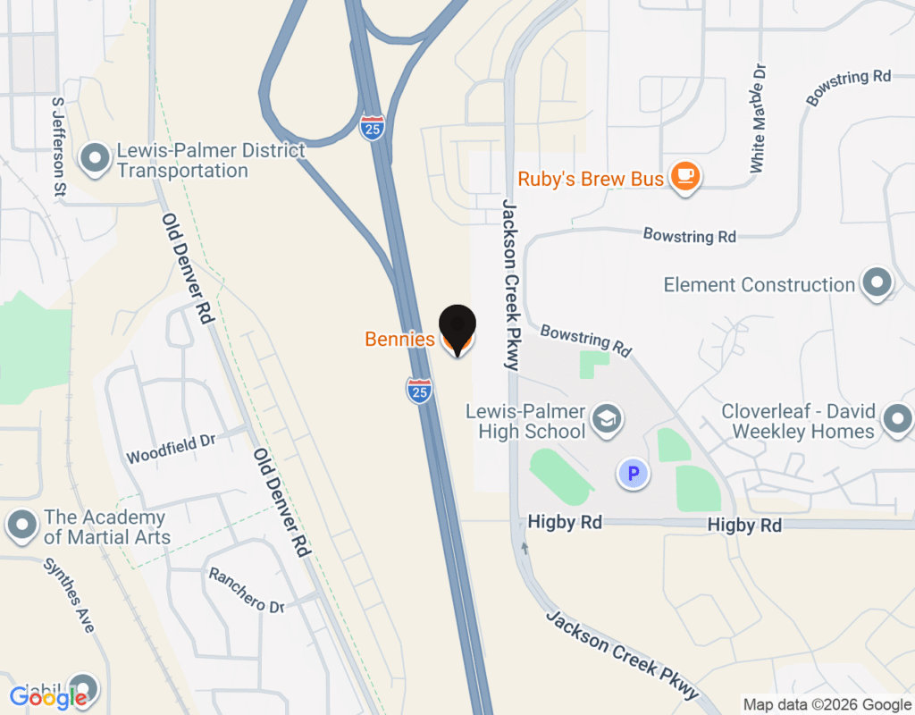 A map view showing a location pin near Interstate 25 and Jackson Creek Parkway, with nearby labeled points including Bennie's, Lewis Palmer High School, Ruby's Brew Bus, and Old Denver Road.